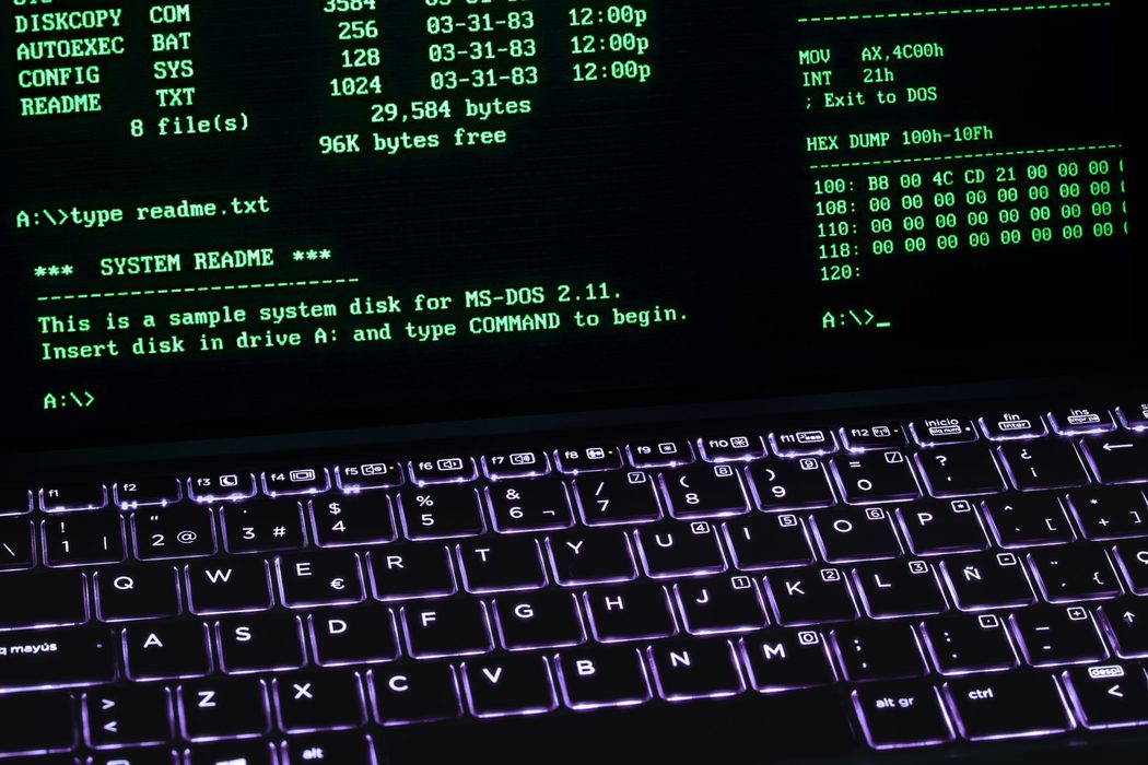 A laptop displaying a terminal window with command line text